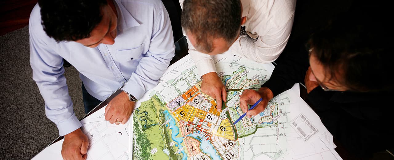 Image of people looking over a map