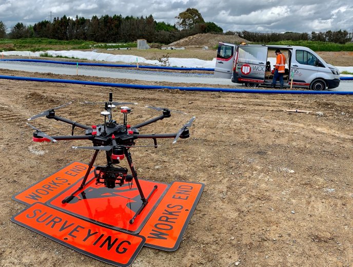 Drone landed on work caution signs Woods van in background