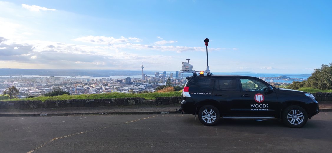 Mobile laser scanning vehicle on Auckland mountain overlooking city